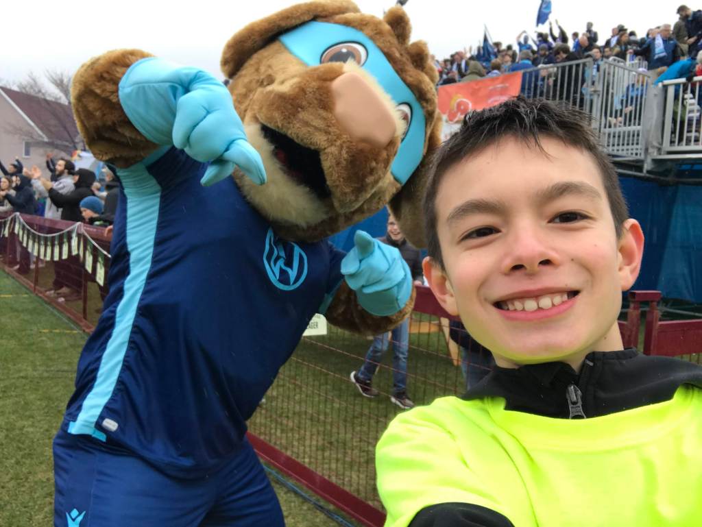Jack Murray catching a selfie with HFX Wanderers mascot, Rover. [credit: CPL Fever]